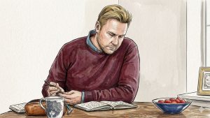 Dagbogsskrivning mod stress: En mand skriver i en notesbog ved et roligt bord.